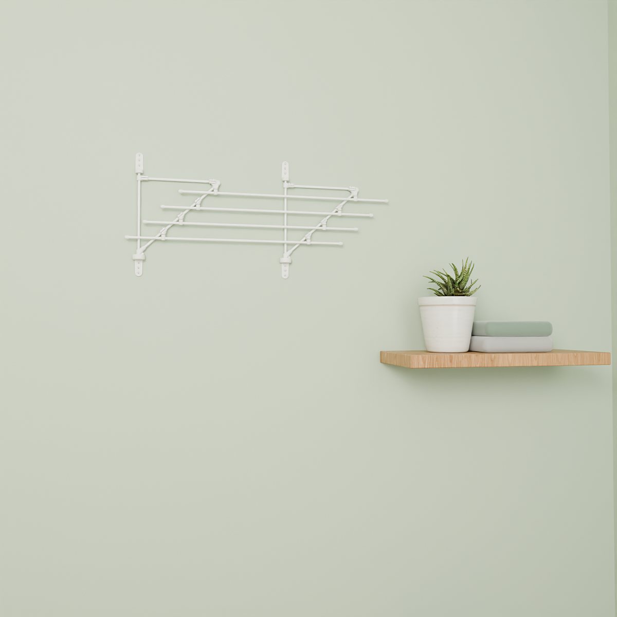 White Airstair folded flat against a sage green wall